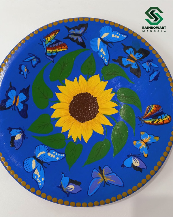 خرید دیوارکوب سفالی آبی تزئینی با نقوش دات ماندالا از فروشگاه رینبوآرت | نقوش آفتابگردان | ارسال رایگان در رشت